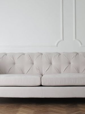 Photo Of White Couch On Wooden Floor