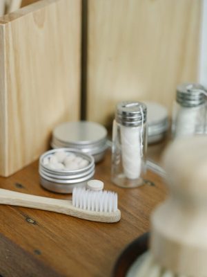 Toothbrush near dental floss in bathroom